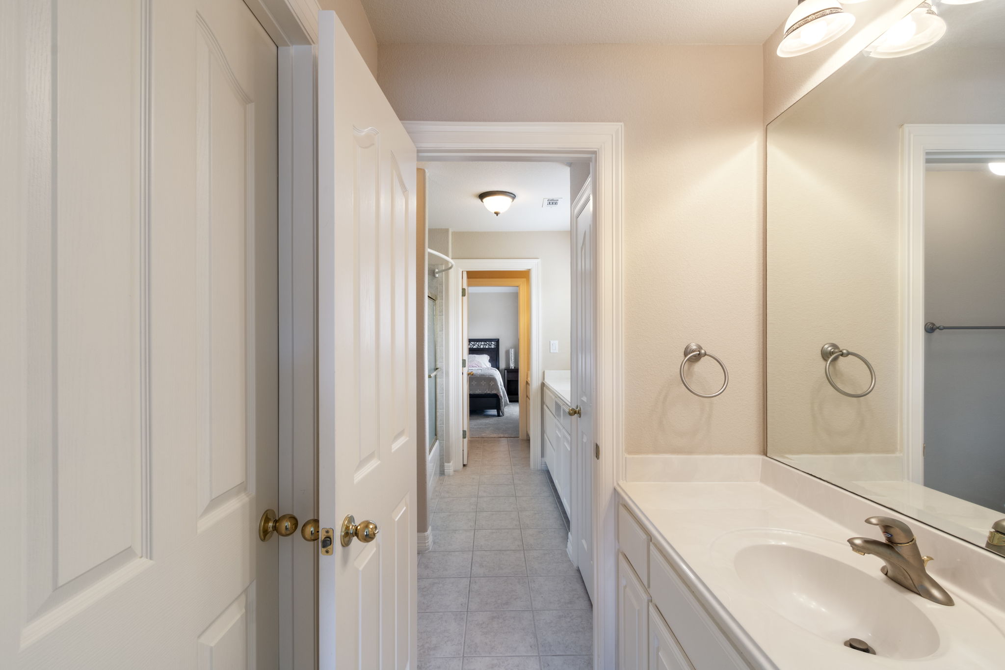 15 Sarazen Loop North Georgetown, TX 78628 - Photo 32 of 40 Bathroom featuring vanity, tile patterned floors, and ensuite bath