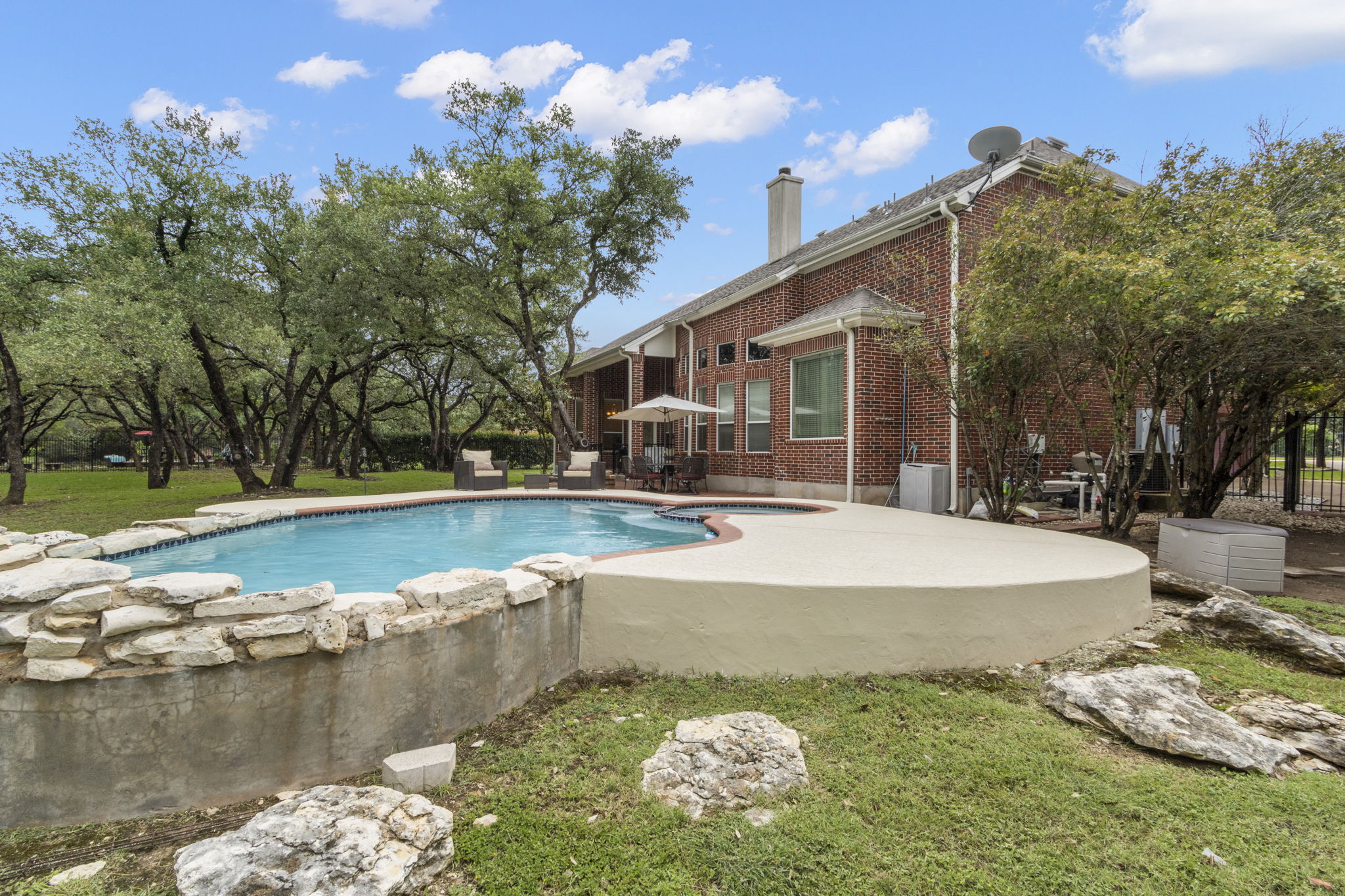 15 Sarazen Loop North Georgetown, TX 78628 - Photo 37 of 40 Outdoor pool with a patio area and a lawn
