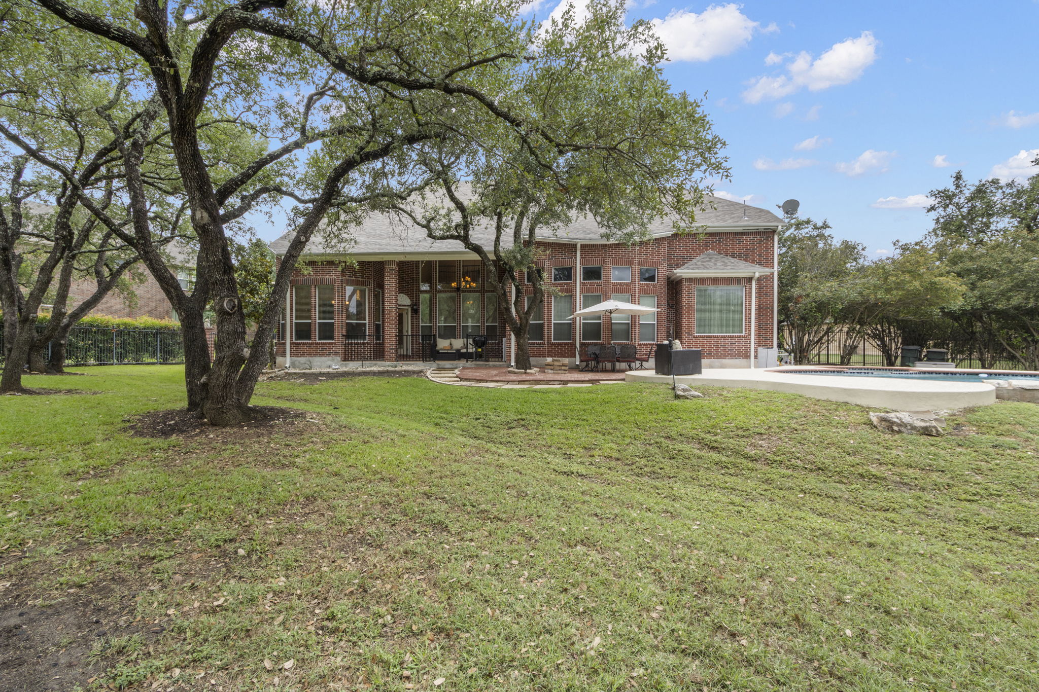 15 Sarazen Loop North Georgetown, TX 78628 - Photo 39 of 40 Back of property featuring brick siding and a patio area