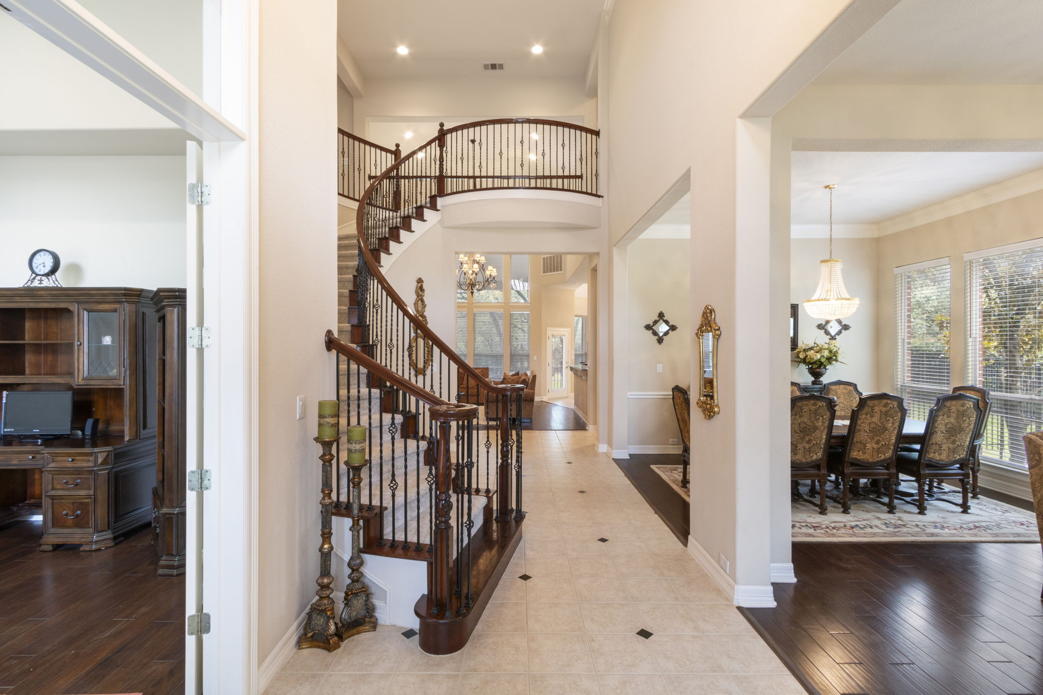 15 Sarazen Loop North Georgetown, TX 78628 - Photo 5 of 40 Entryway featuring stairs, baseboards, a high ceiling, wood finished floors, and recessed lighting