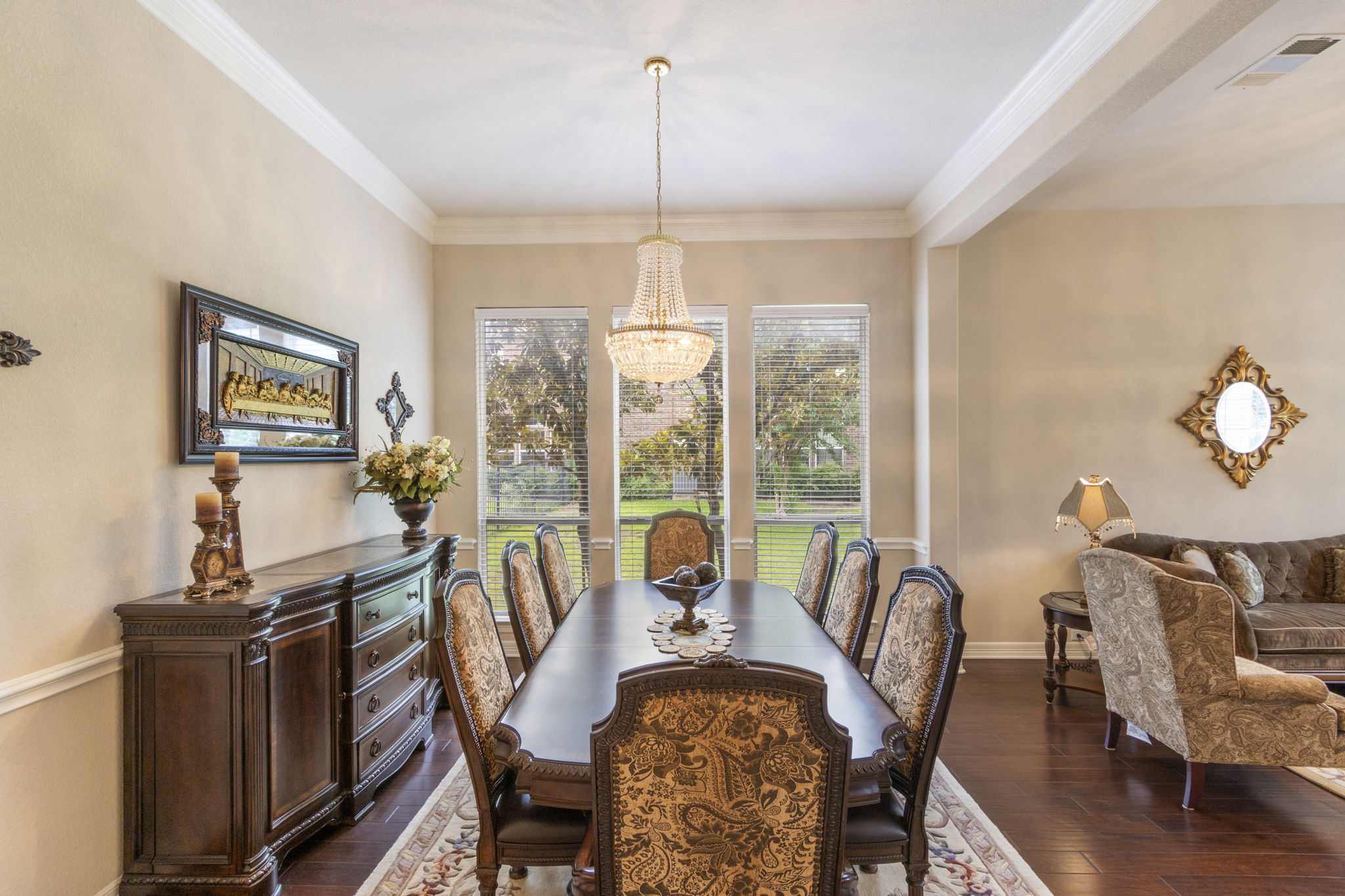 15 Sarazen Loop North Georgetown, TX 78628 - Photo 9 of 40 Dining area with a chandelier, dark wood-style floors, ornamental molding, and baseboards