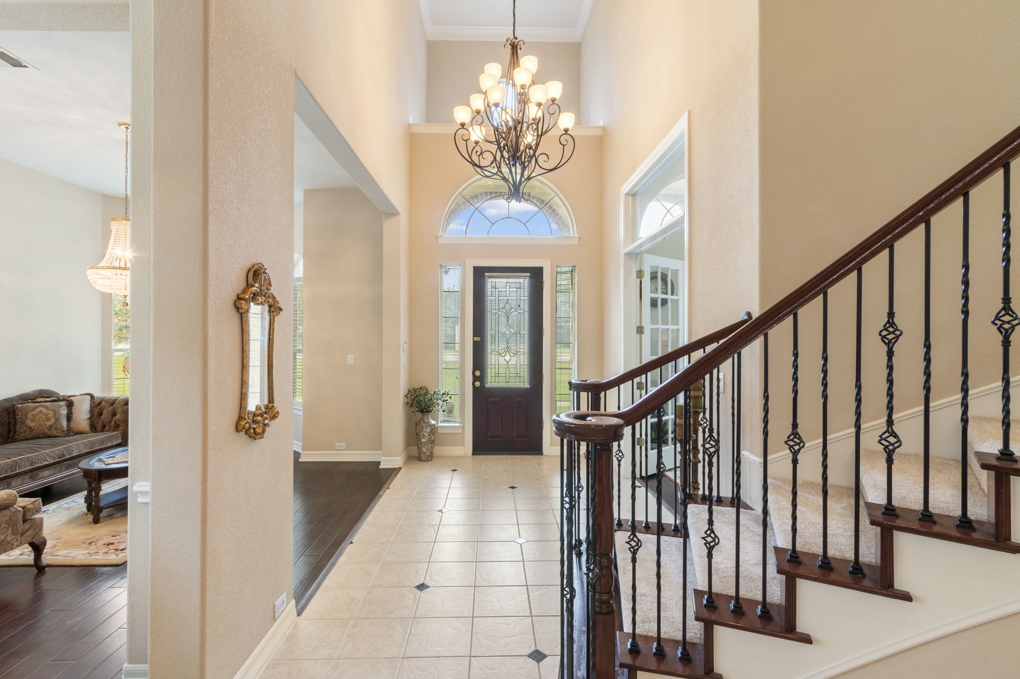 15 Sarazen Loop North Georgetown, TX 78628 - Photo 10 of 40 Foyer featuring a high ceiling, stairway, a chandelier, ornamental molding, and baseboards