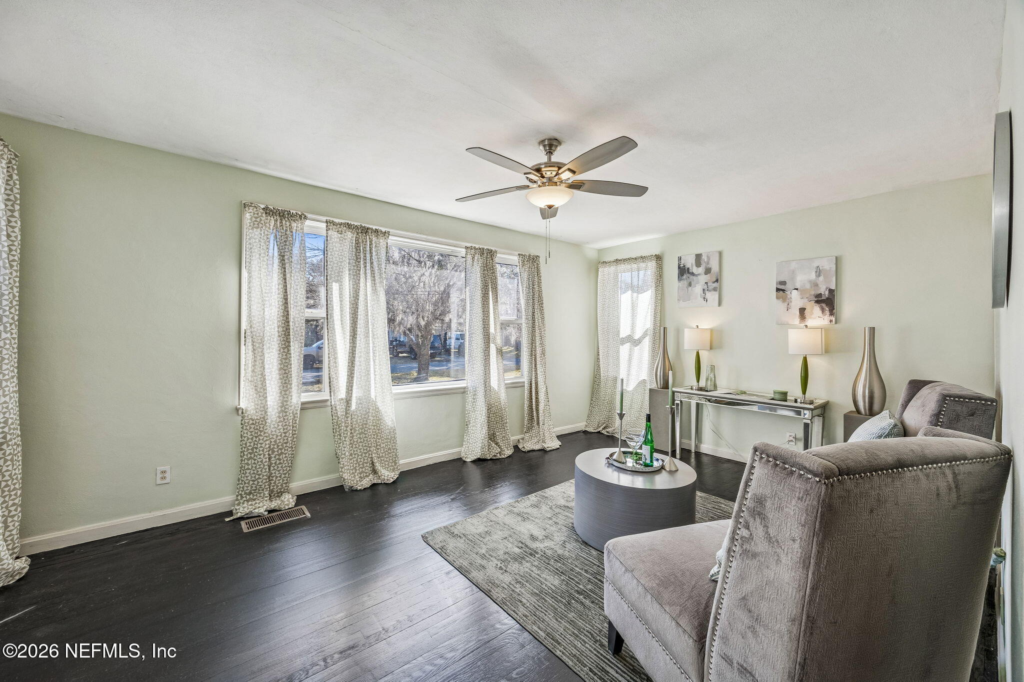 426 Aiken Road Jacksonville, FL 32216 - Photo 15 of 50 a living room with furniture potted plant and a window