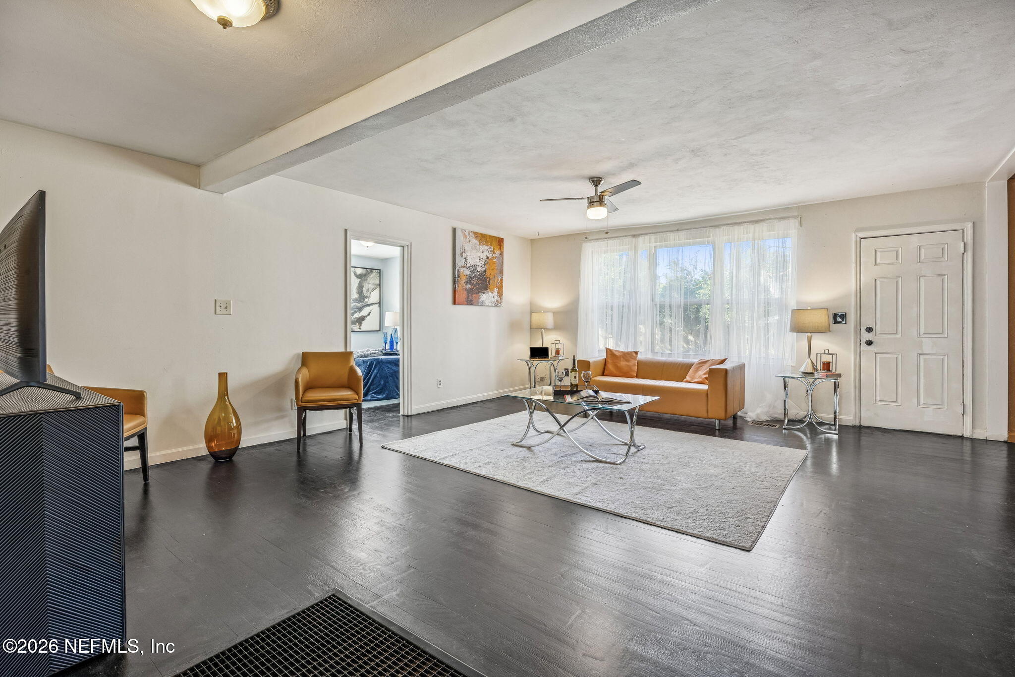 426 Aiken Road Jacksonville, FL 32216 - Photo 21 of 50 a living room with furniture and a wooden floor