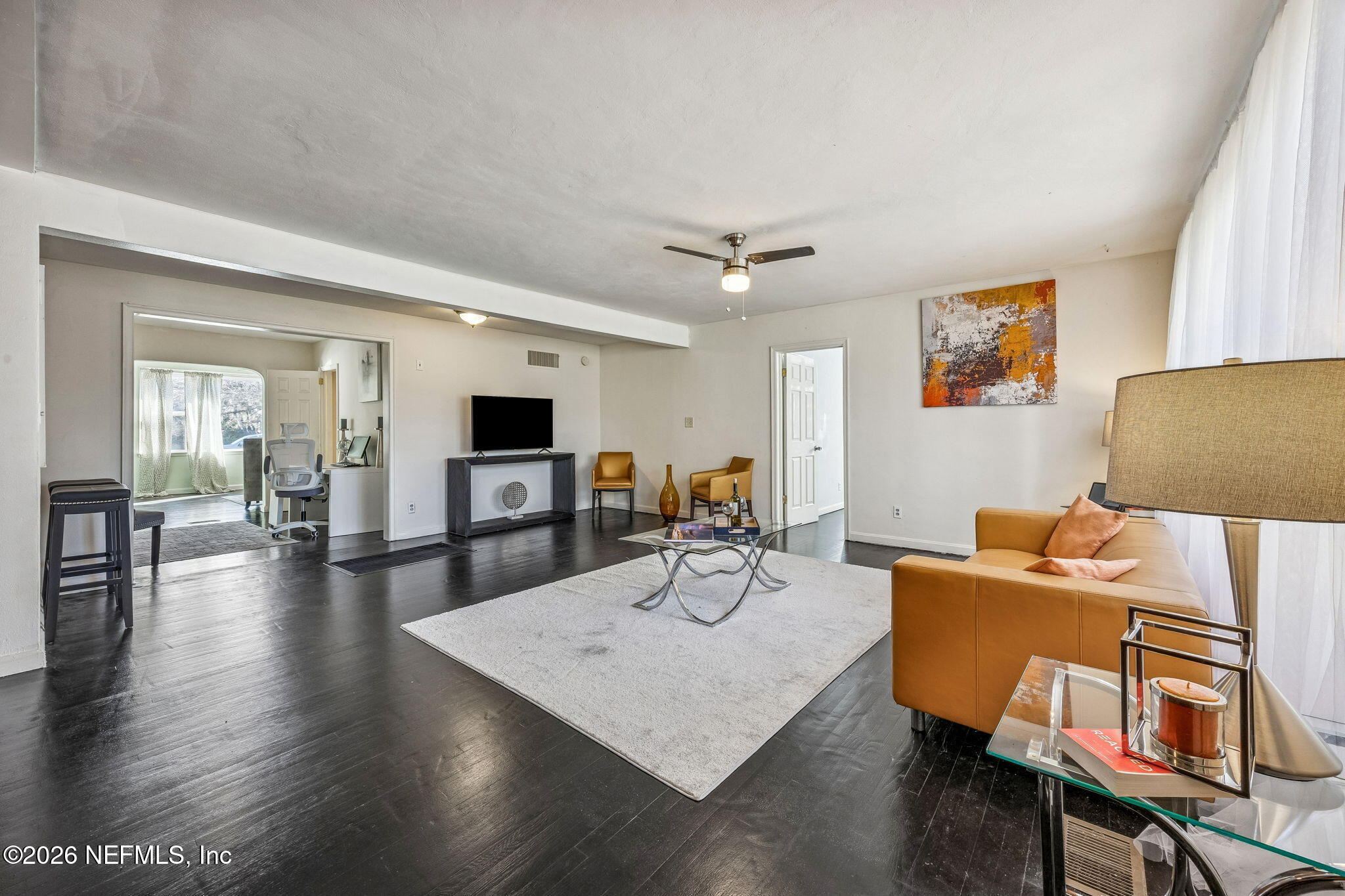 426 Aiken Road Jacksonville, FL 32216 - Photo 25 of 50 a living room with furniture and a flat screen tv