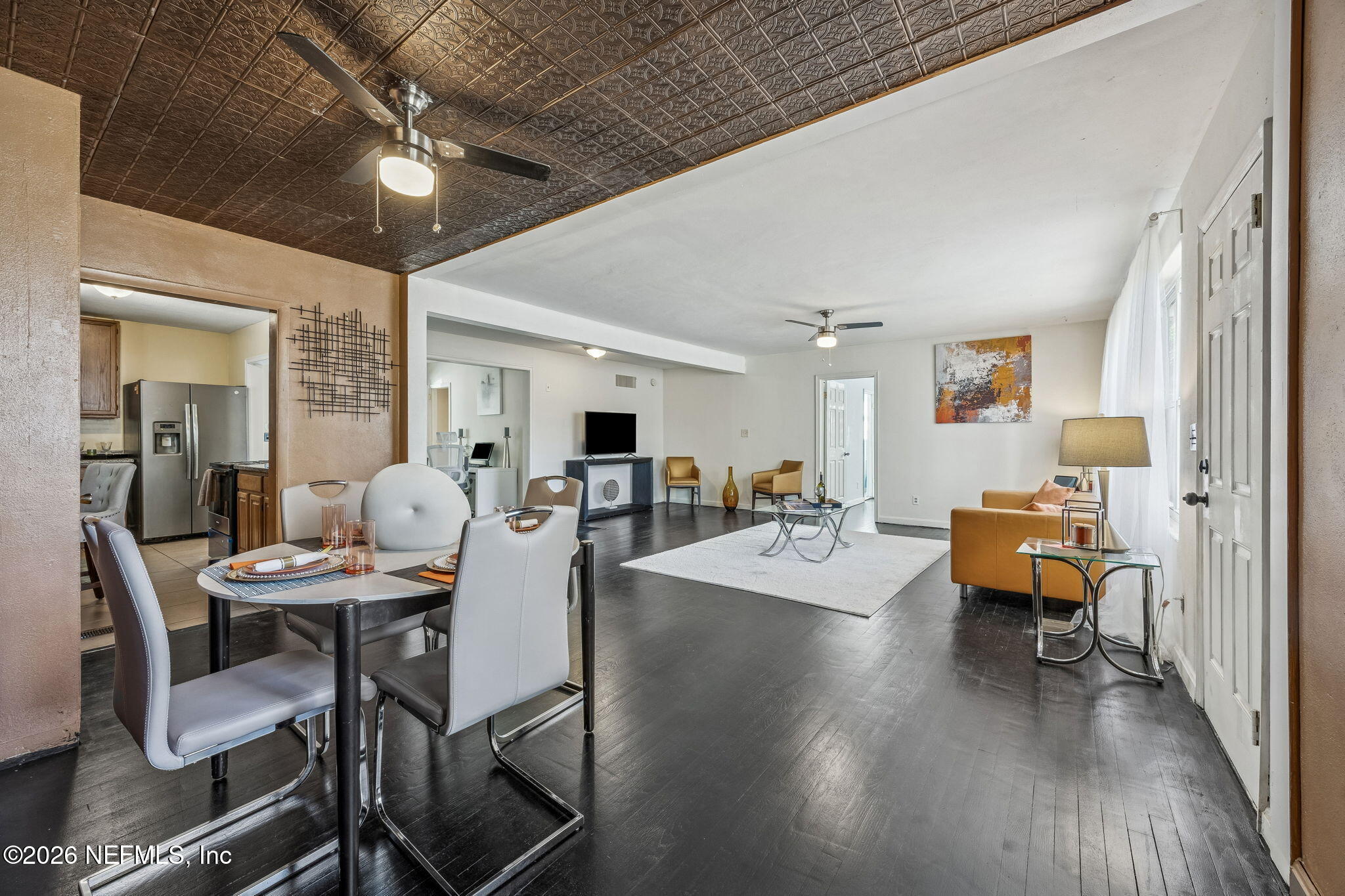 426 Aiken Road Jacksonville, FL 32216 - Photo 28 of 50 a view of a dining room with furniture and wooden floor