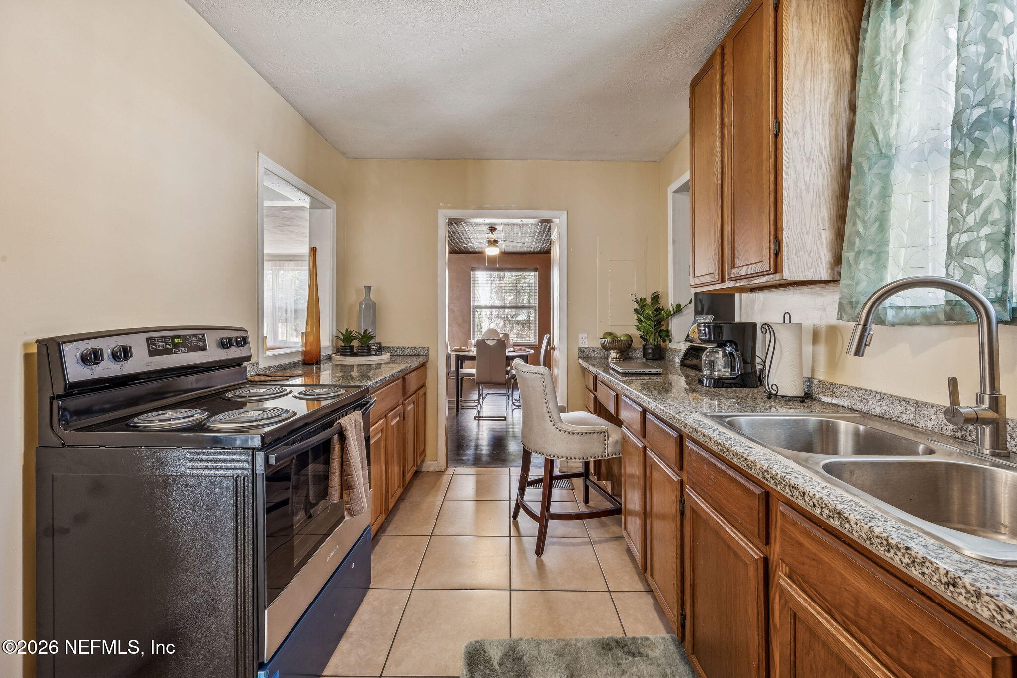 426 Aiken Road Jacksonville, FL 32216 - Photo 33 of 50 a kitchen with a stove sink and cabinets