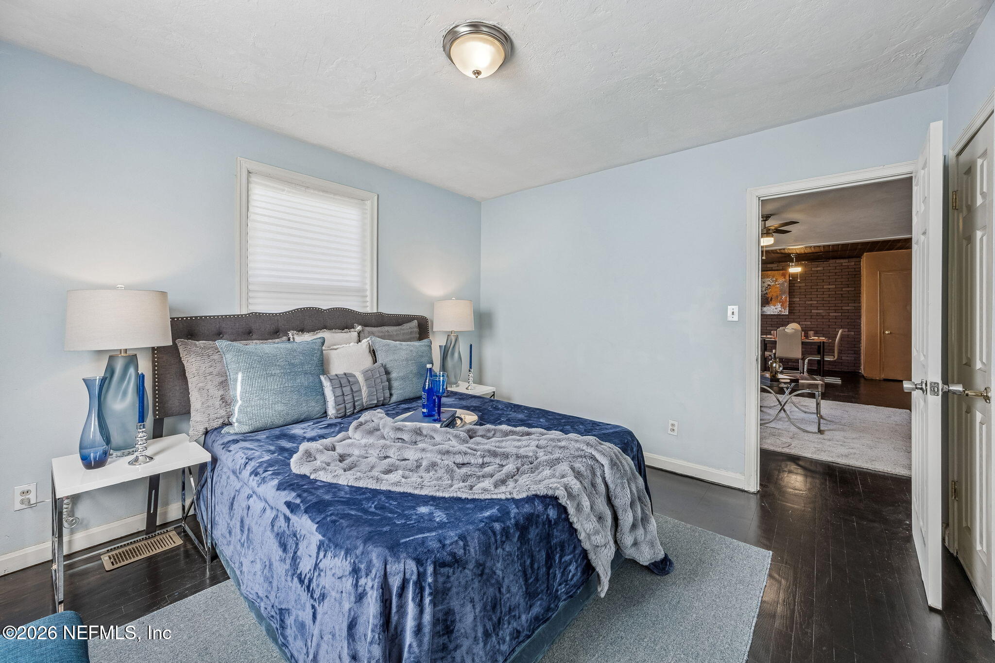 426 Aiken Road Jacksonville, FL 32216 - Photo 38 of 50 a bed room with a bed and a lamp