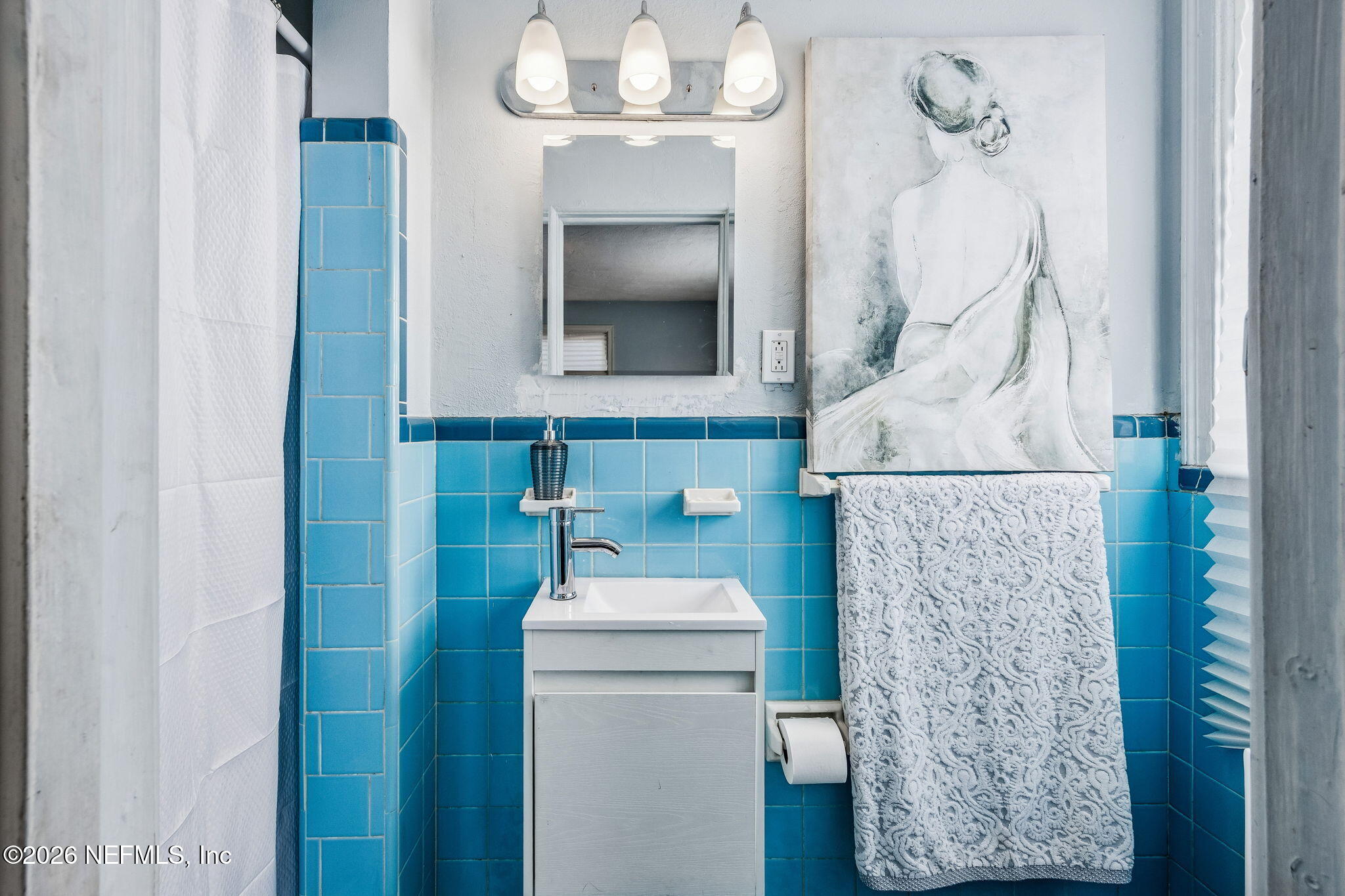 426 Aiken Road Jacksonville, FL 32216 - Photo 39 of 50 a bathroom with a sink and mirror