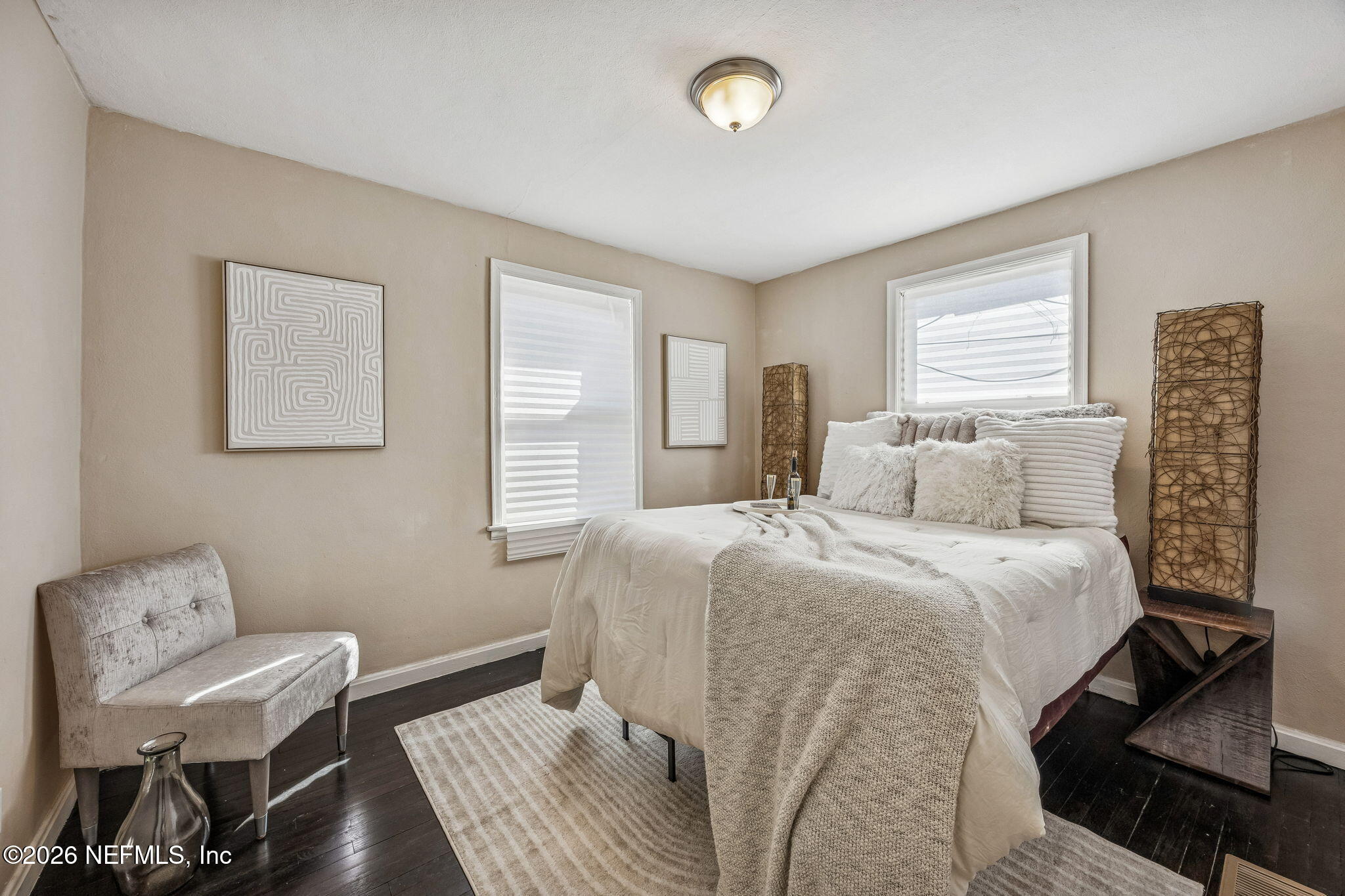 426 Aiken Road Jacksonville, FL 32216 - Photo 40 of 50 a bedroom with a bed and wooden floor