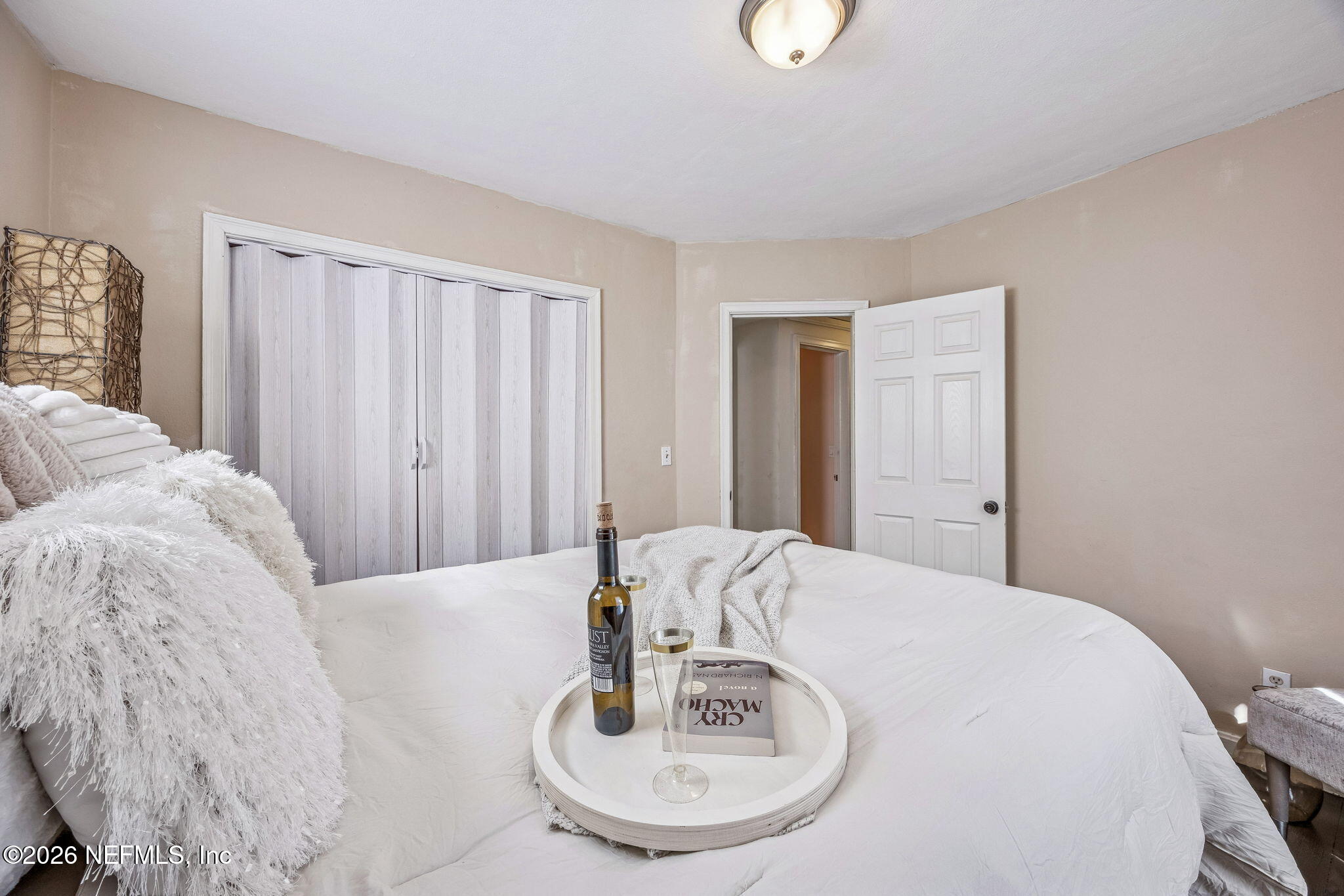 426 Aiken Road Jacksonville, FL 32216 - Photo 41 of 50 a bedroom with a bed and a mirror