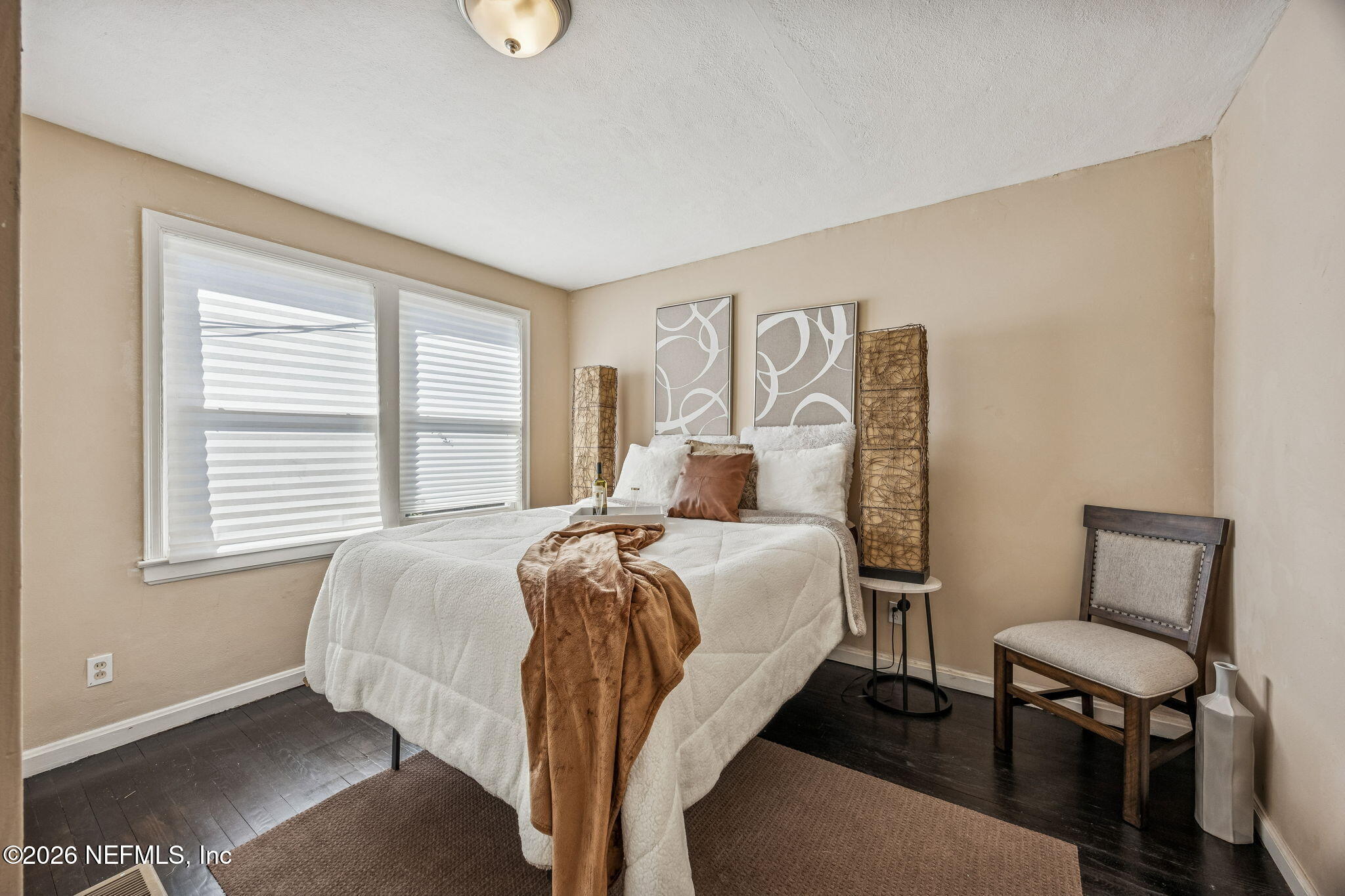 426 Aiken Road Jacksonville, FL 32216 - Photo 42 of 50 a bed room with a bed window and a chair