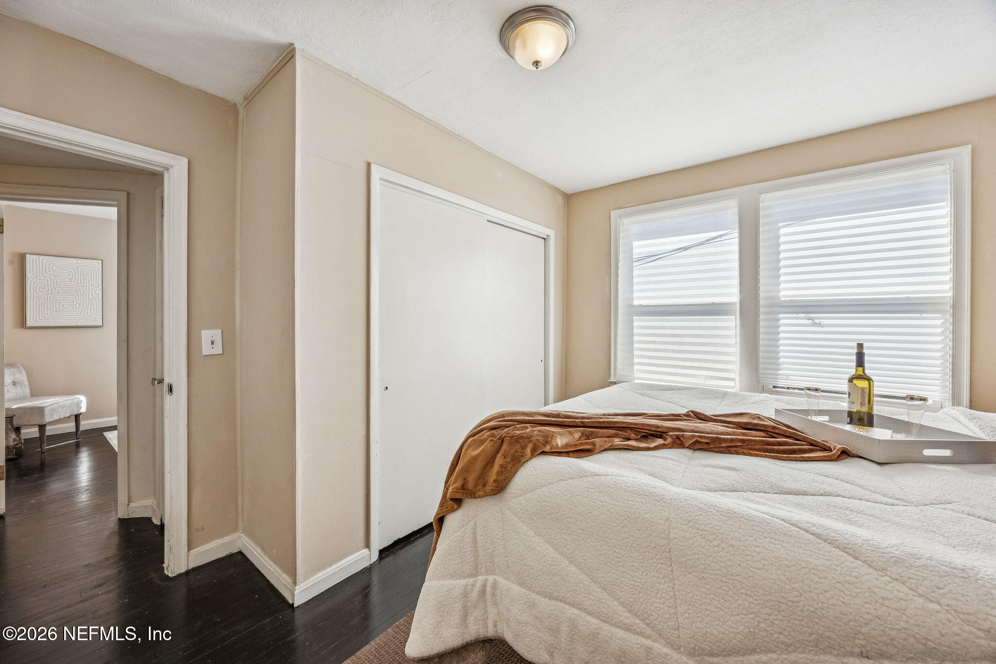 426 Aiken Road Jacksonville, FL 32216 - Photo 43 of 50 a bedroom with a bed and wooden floor