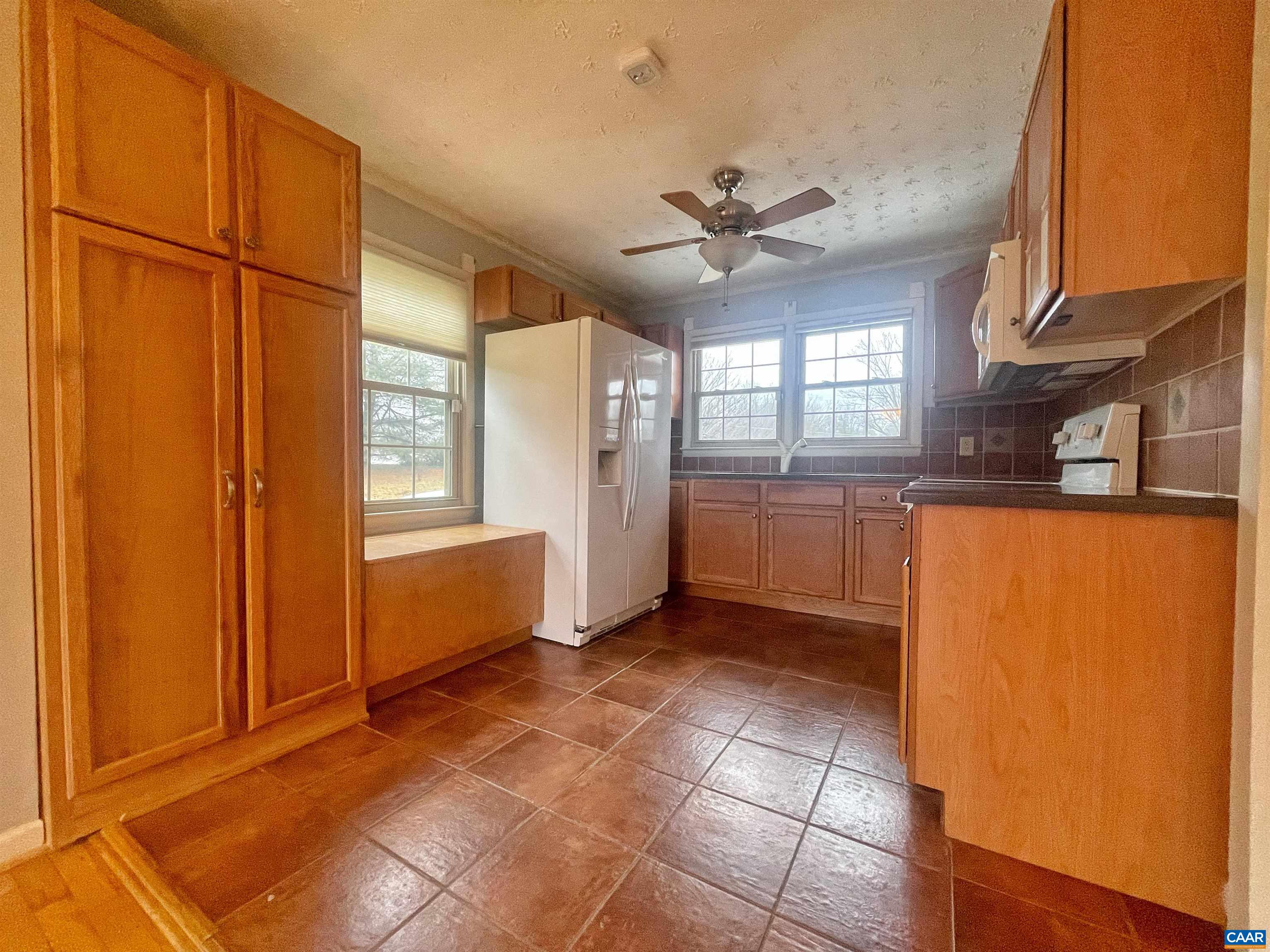 384 Carpenters Mill Road Ruckersville, VA 22968 - Photo 12 of 27 a view of a kitchen with an empty space and a window