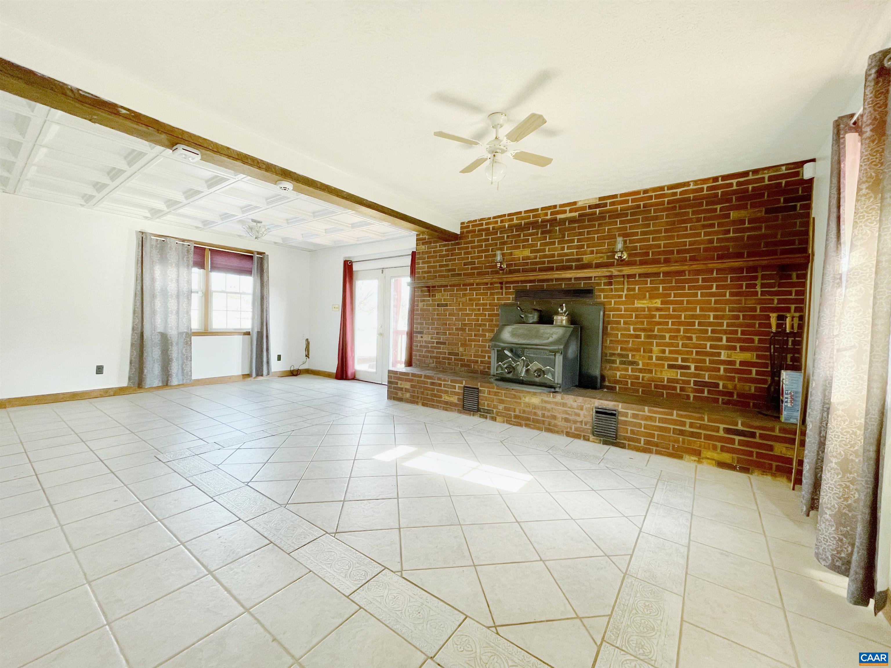384 Carpenters Mill Road Ruckersville, VA 22968 - Photo 19 of 27 a view of empty room with wooden floor
