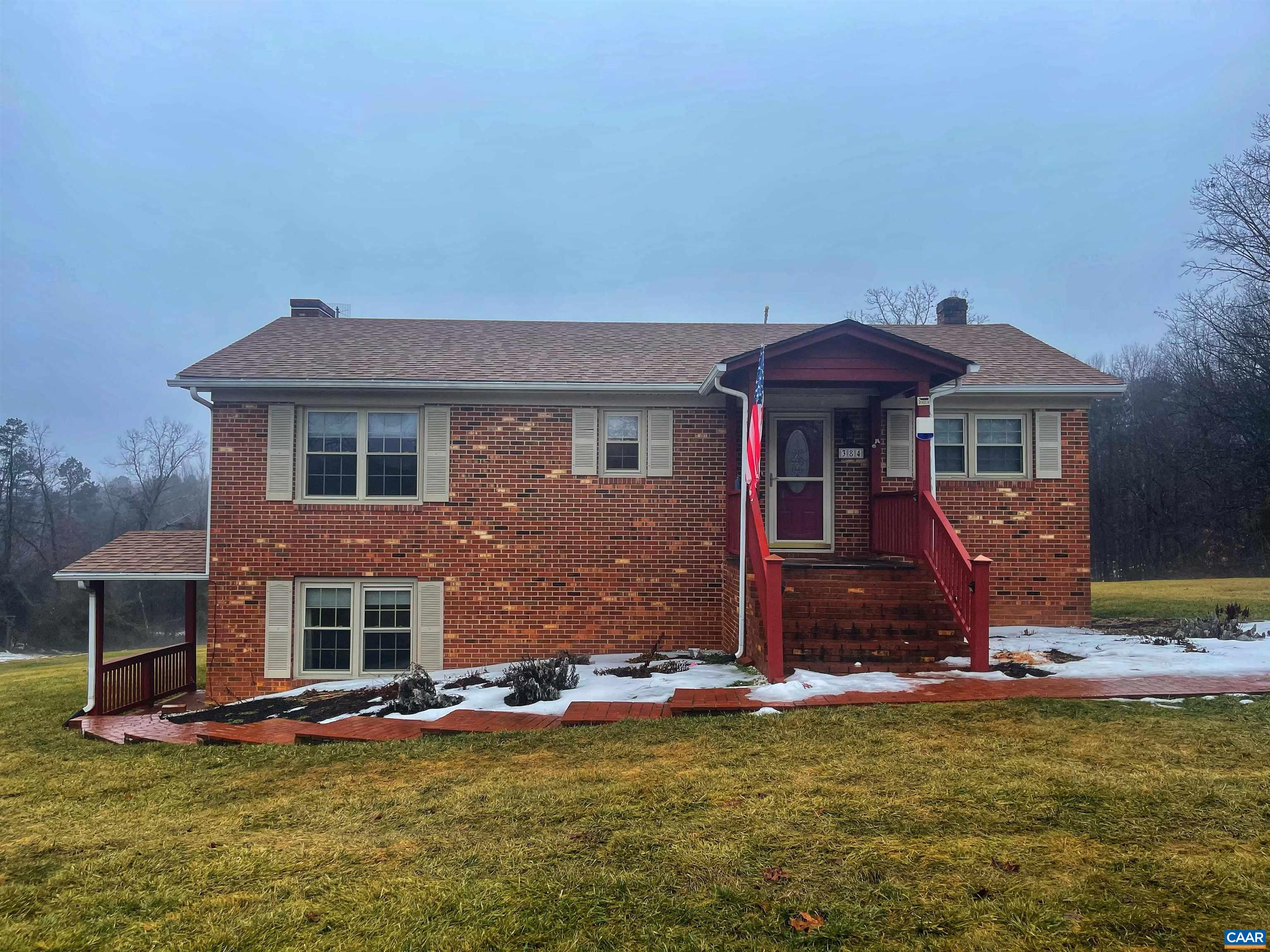 384 Carpenters Mill Road Ruckersville, VA 22968 - Photo 2 of 27 a front view of a house with a yard