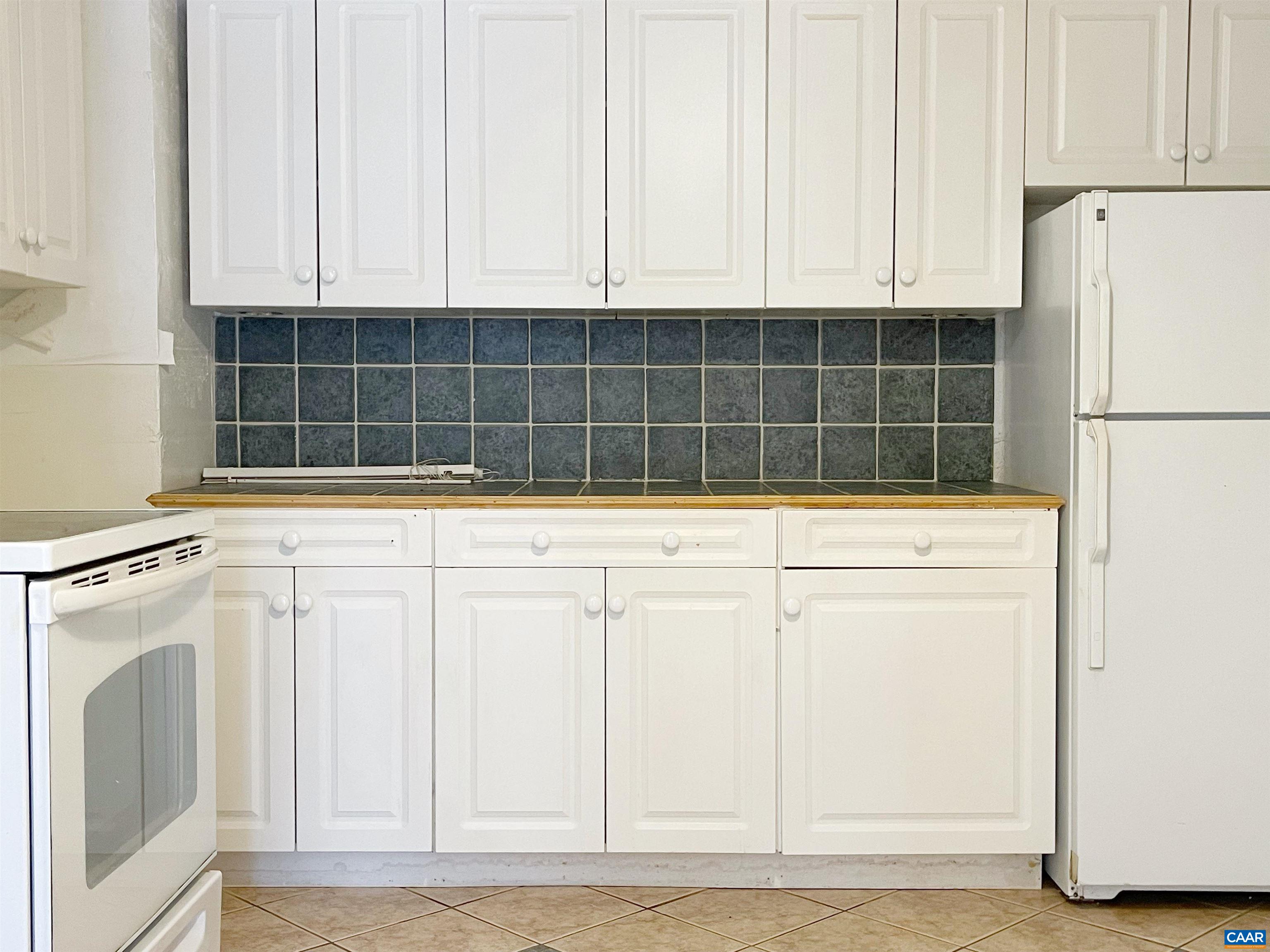 384 Carpenters Mill Road Ruckersville, VA 22968 - Photo 24 of 27 a view of a kitchen with dishwasher and white cabinets