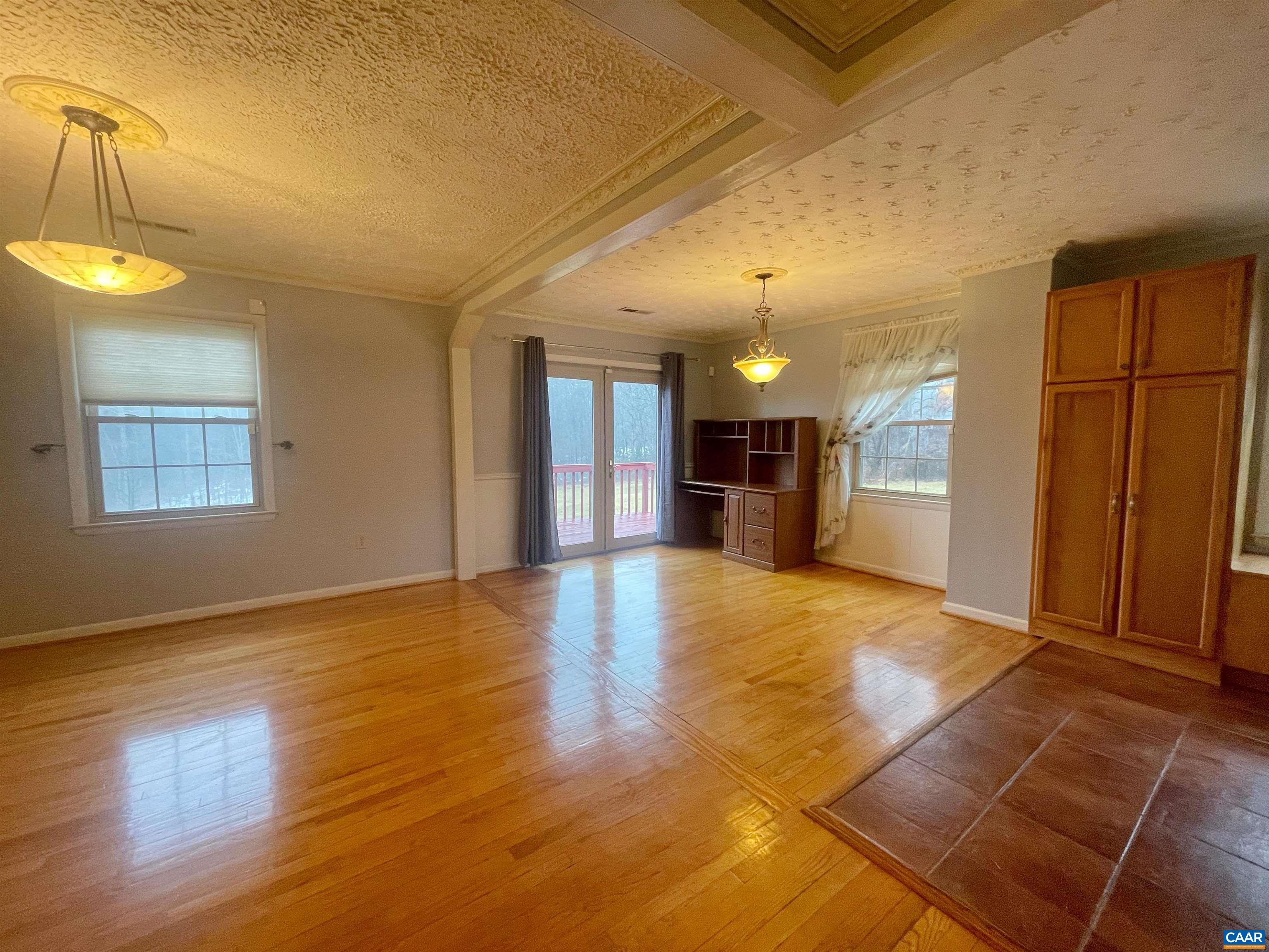 384 Carpenters Mill Road Ruckersville, VA 22968 - Photo 7 of 27 a view of an empty room and a kitchen