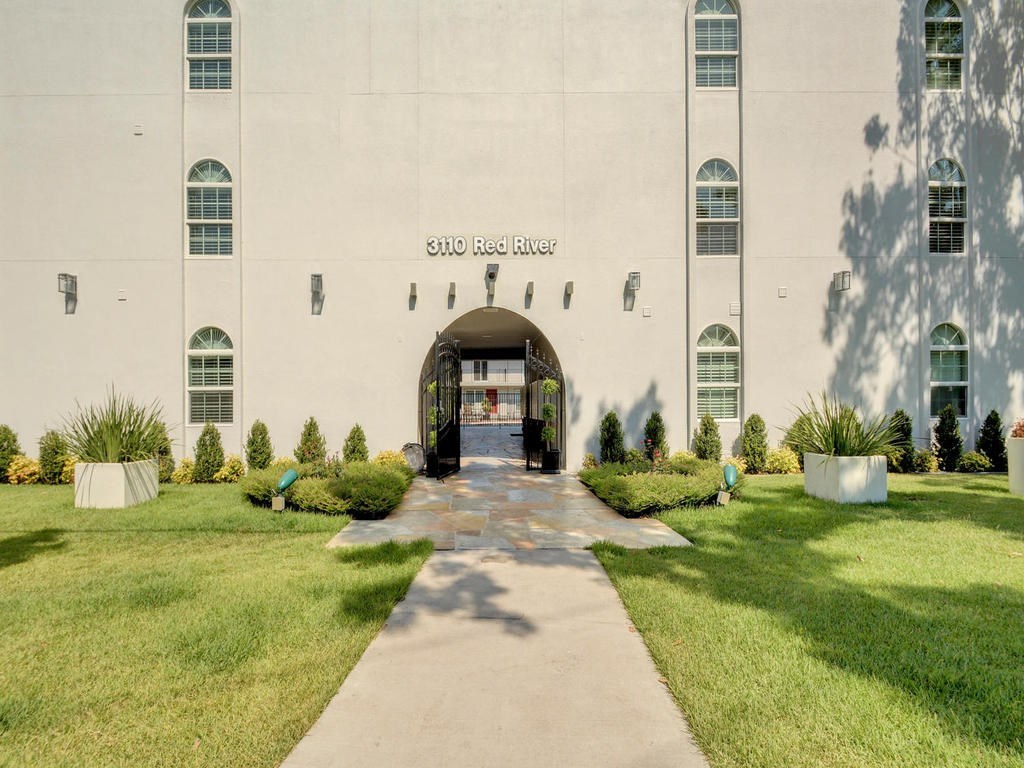 3110 Red River Street, Unit 206 Austin, TX 78705 - Photo 8 of 11 a front view of a building with garden
