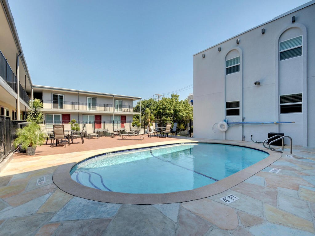 3110 Red River Street, Unit 206 Austin, TX 78705 - Photo 9 of 11 a view of a swimming pool with outdoor seating