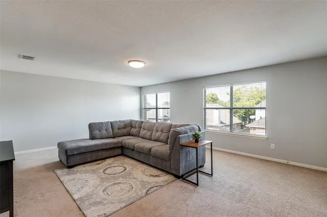 a living room with furniture and window