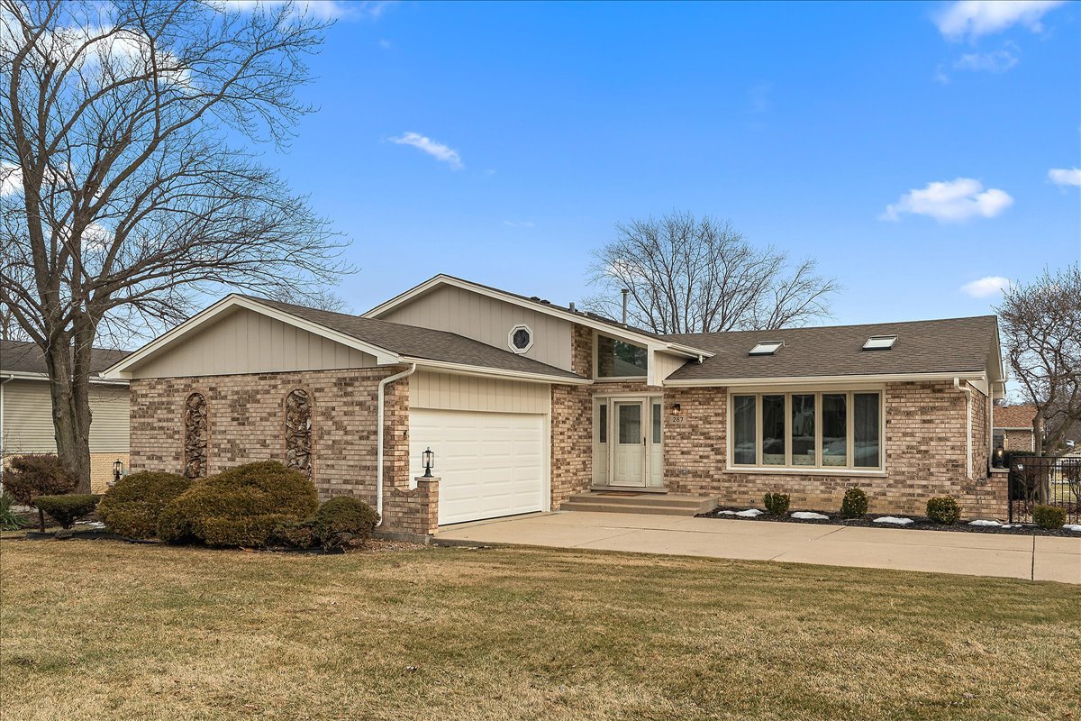 267 Center Road Frankfort, IL 60423 - Photo 1 of 26 a front view of a house with a yard and garage
