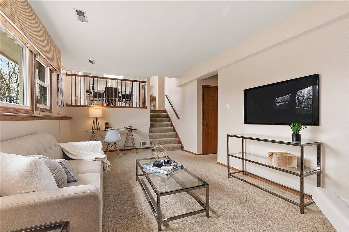 267 Center Road Frankfort, IL 60423 - Photo 11 of 26 a living room with furniture and a flat screen tv
