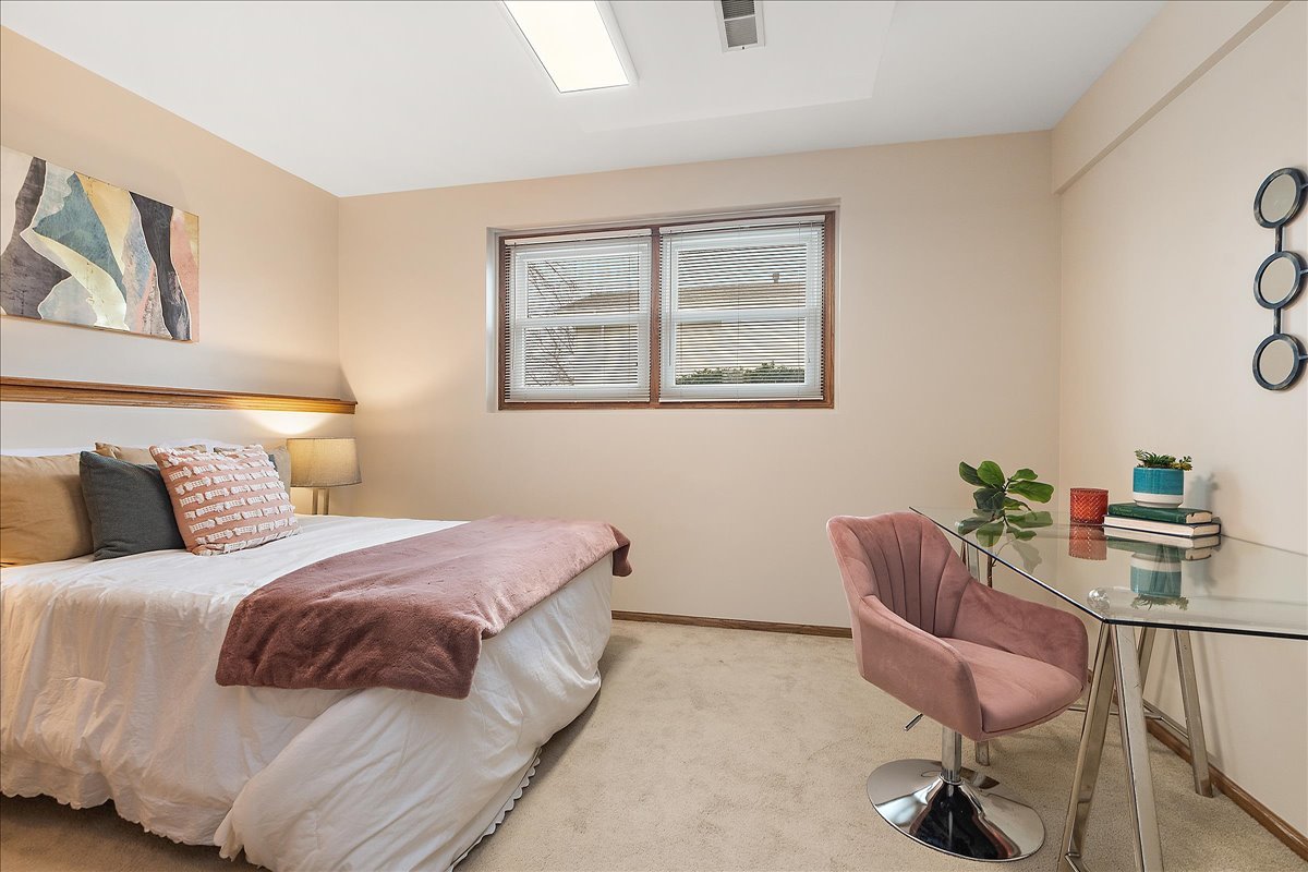 267 Center Road Frankfort, IL 60423 - Photo 13 of 26 a bedroom with a bed and a chair