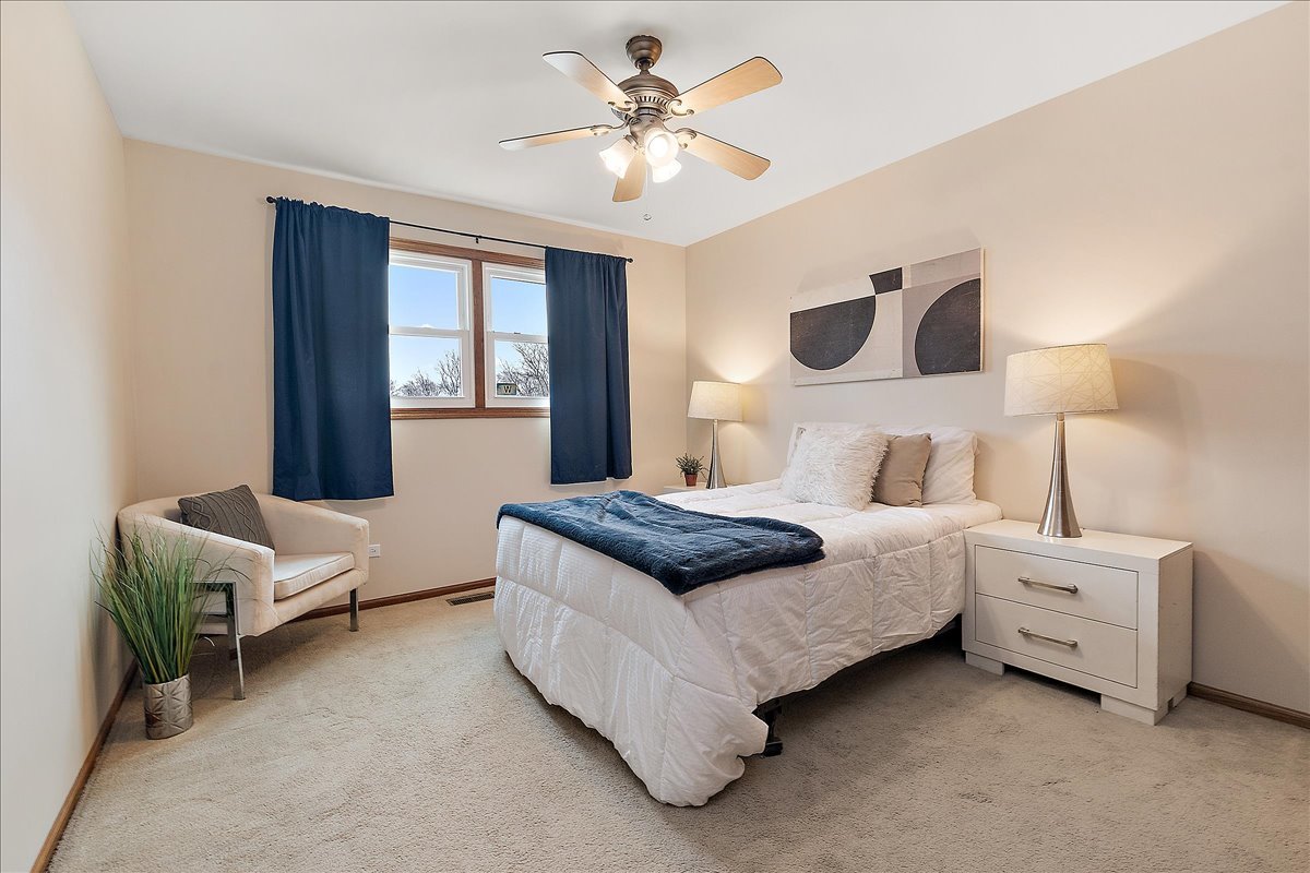 267 Center Road Frankfort, IL 60423 - Photo 18 of 26 a bedroom with a bed couch and window