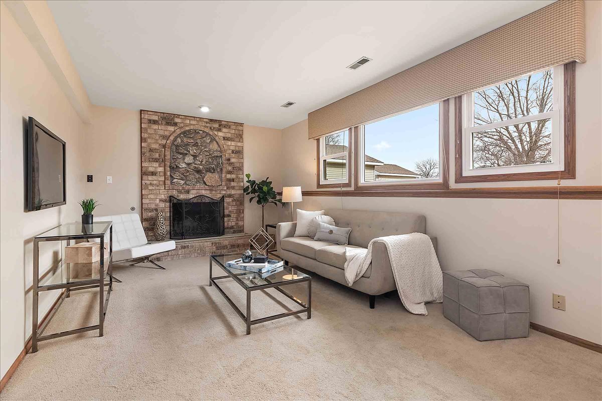 267 Center Road Frankfort, IL 60423 - Photo 10 of 26 a living room with furniture and a fireplace