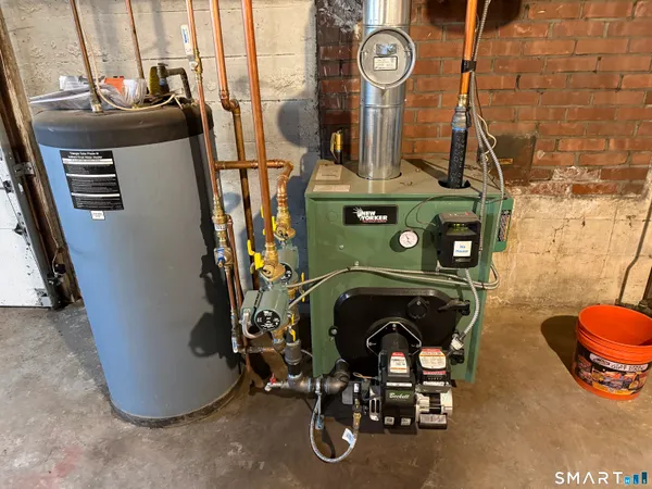 a view of living room with furniture and a fireplace