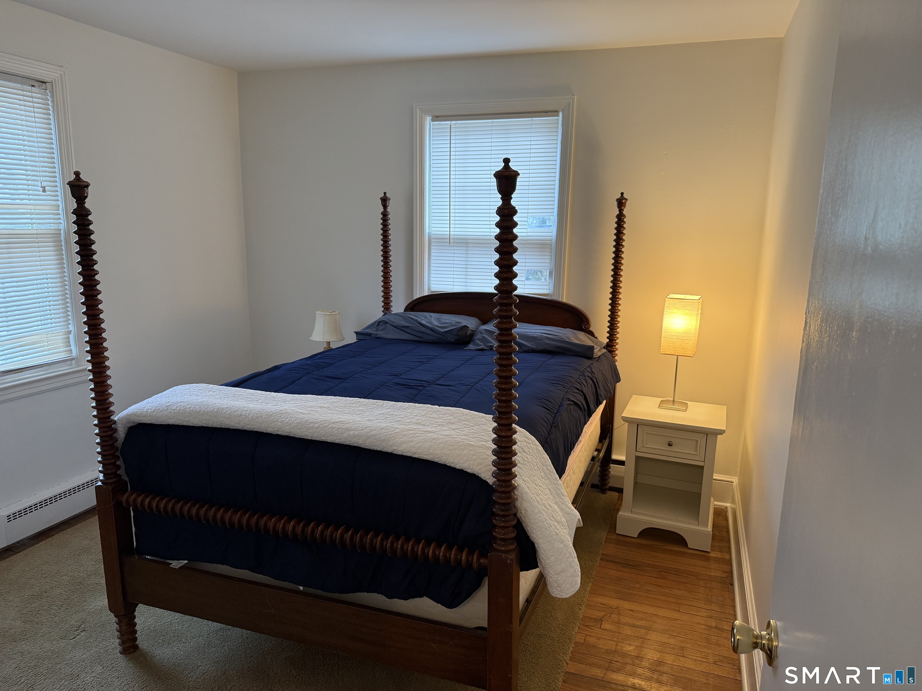 20 Richards Grove Road Waterford, CT 06375 - Photo 9 of 10 a bedroom with a bed and wooden floor