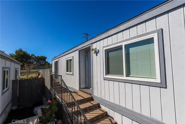 a view of a balcony with chairs