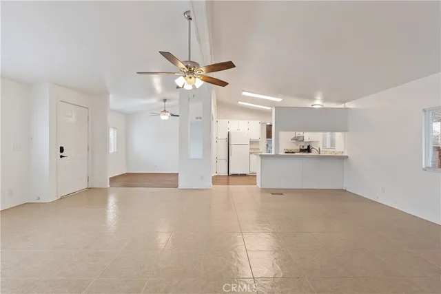 a view of a kitchen with a sink and a window