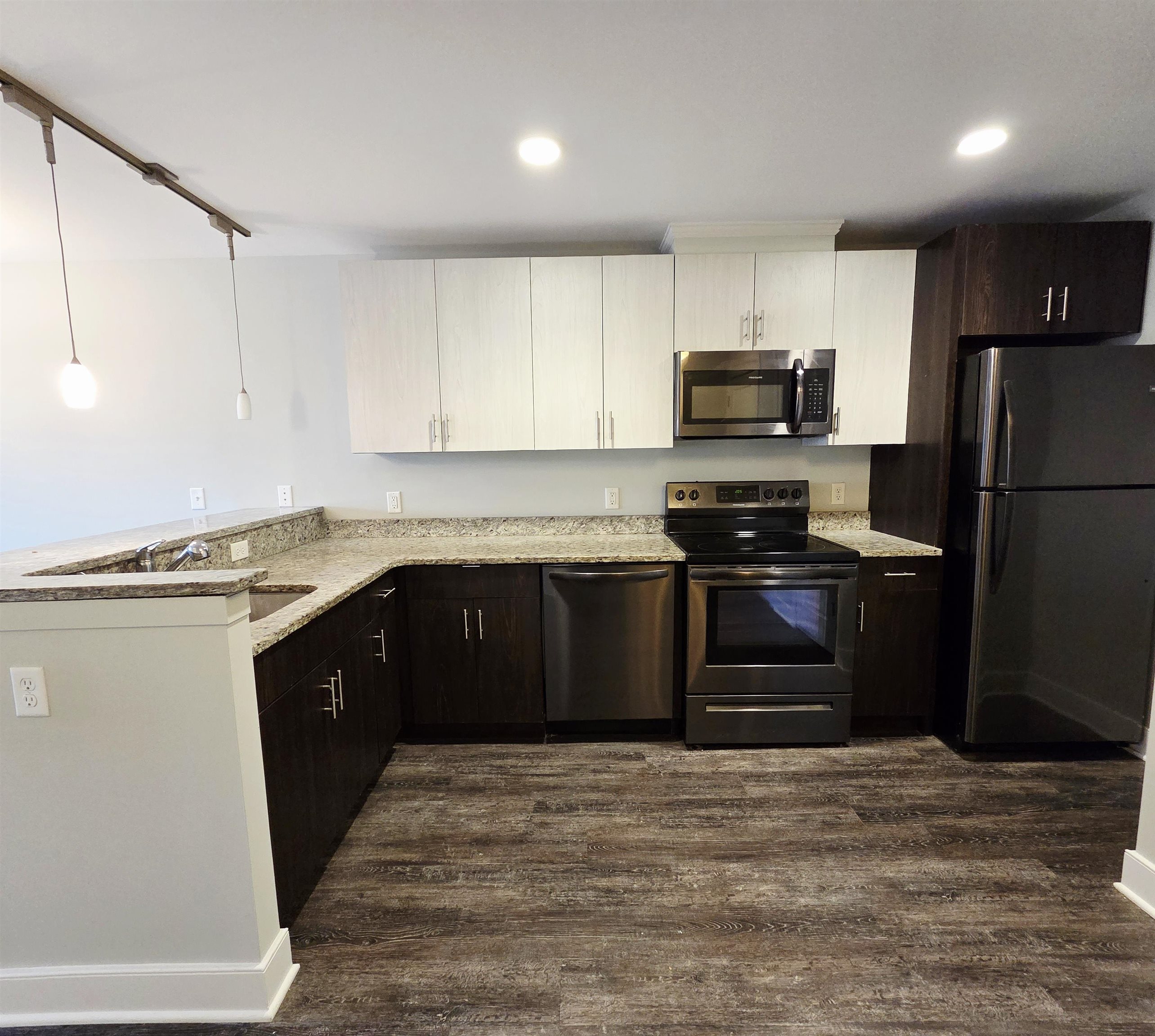 235 Ridge Road, Unit 3C North Arlington, NJ 07031 - Photo 5 of 13 a kitchen with a refrigerator and a stove top oven