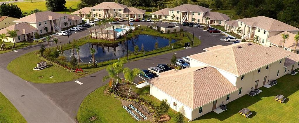 an aerial view of a house with swimming pool outdoor seating
