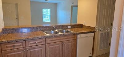 26172 Explorer Road, Unit 2 Punta Gorda, FL 33983 - Photo 4 of 10 a bathroom with a sink and a mirror