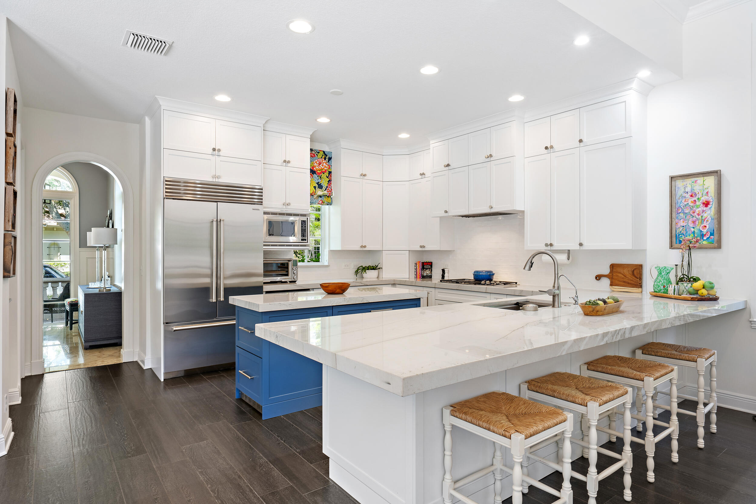 105 Segovia Way Jupiter, FL 33458 - Photo 8 of 33 a kitchen with stainless steel appliances granite countertop a refrigerator and a stove top oven