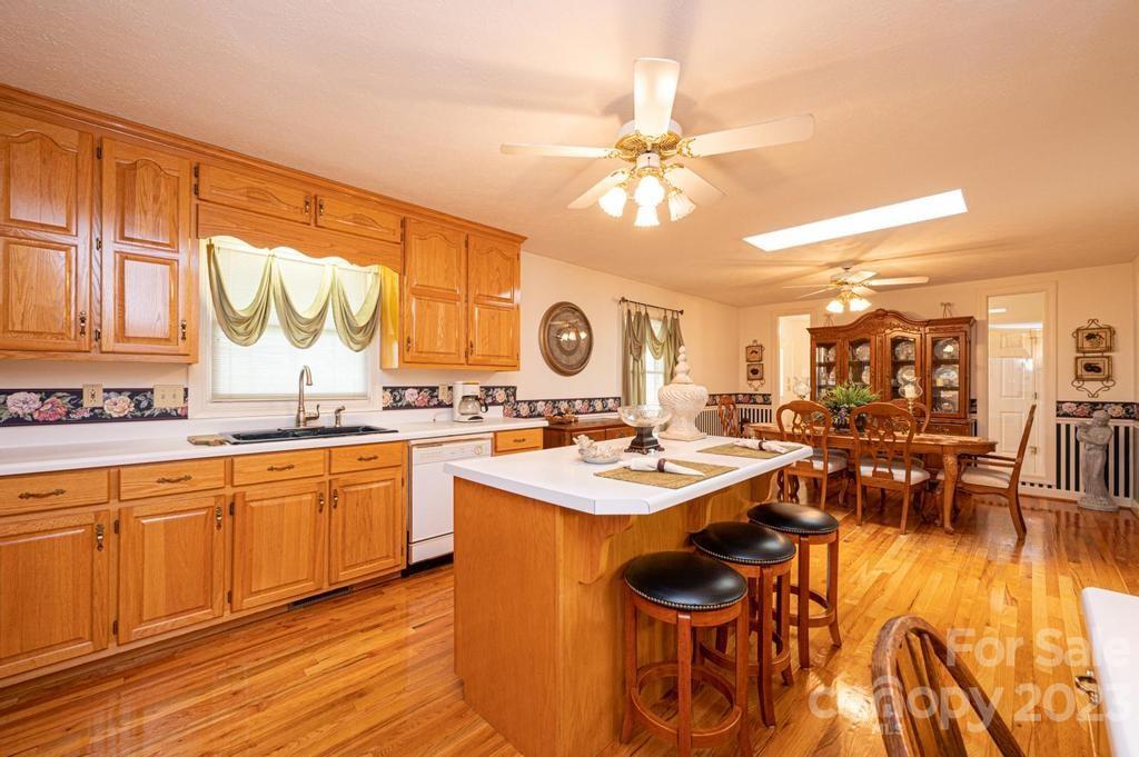 3808 Grace Chapel Road Granite Falls, NC 28630 - Photo 13 of 48 a open kitchen with stainless steel appliances granite countertop a table and chairs