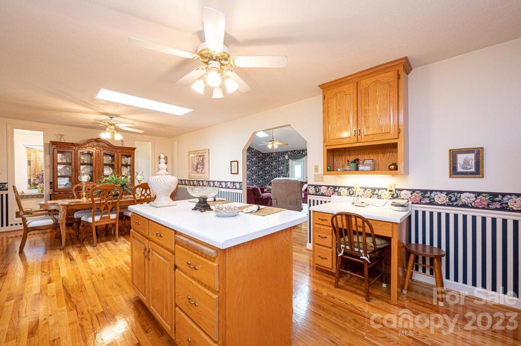 3808 Grace Chapel Road Granite Falls, NC 28630 - Photo 15 of 48 a view of a kitchen with dining table and chairs