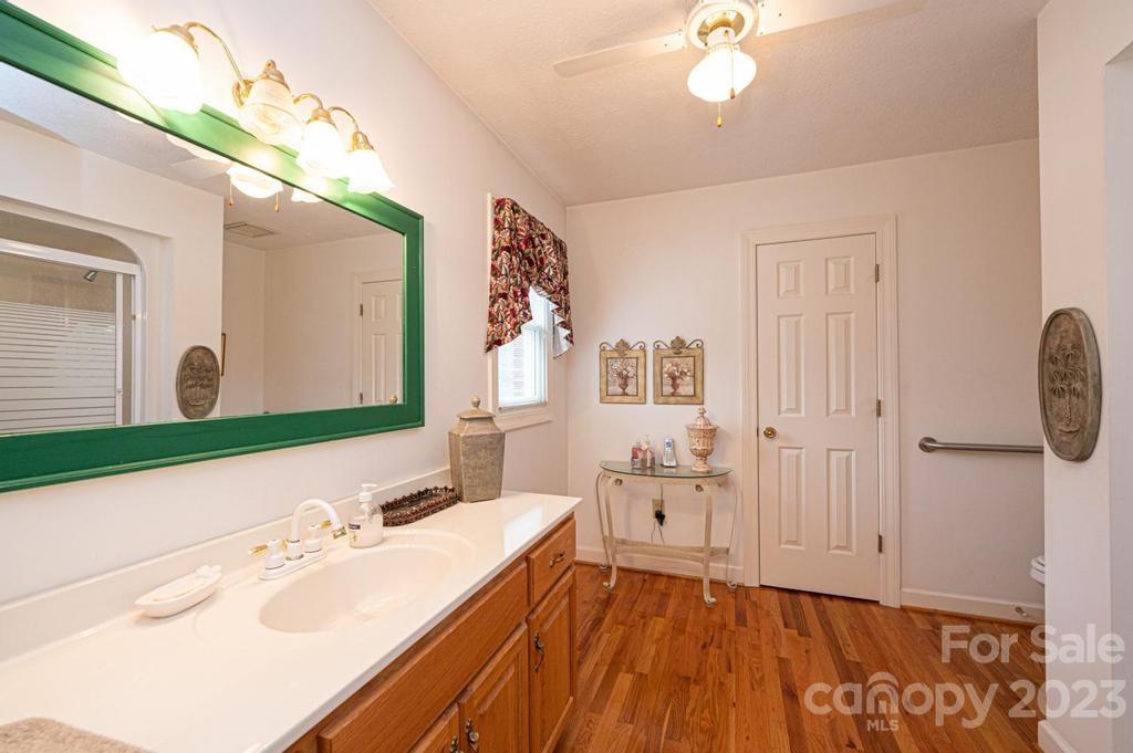 3808 Grace Chapel Road Granite Falls, NC 28630 - Photo 21 of 48 a bathroom with a sink and a mirror