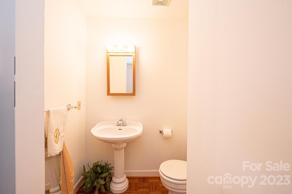 3808 Grace Chapel Road Granite Falls, NC 28630 - Photo 22 of 48 a bathroom with a sink toilet and a mirror