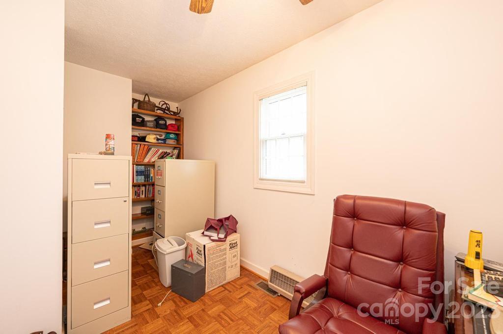 3808 Grace Chapel Road Granite Falls, NC 28630 - Photo 23 of 48 a living room with furniture a flat screen tv and a window