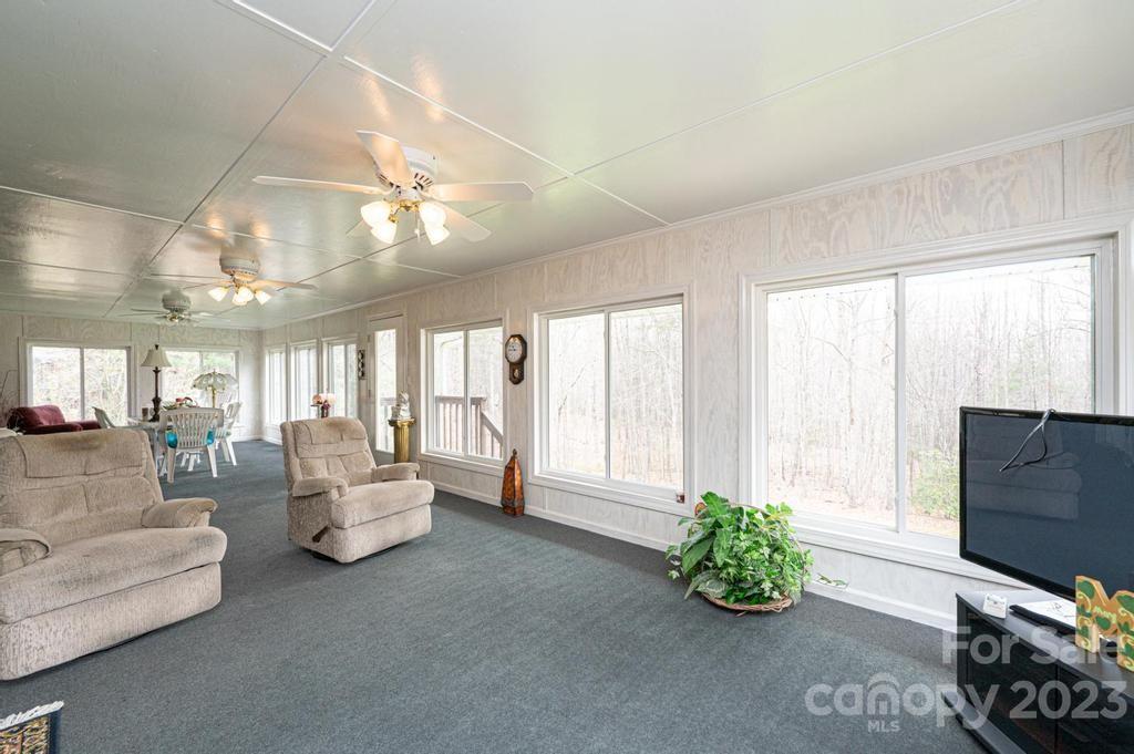 3808 Grace Chapel Road Granite Falls, NC 28630 - Photo 29 of 48 a living room with furniture and a flat screen tv
