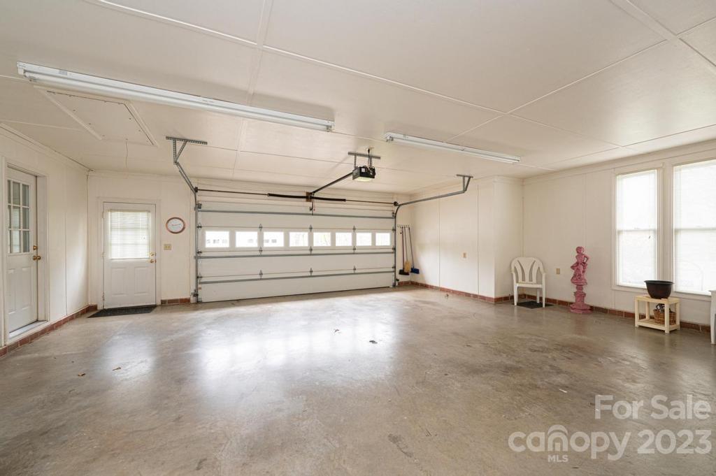 3808 Grace Chapel Road Granite Falls, NC 28630 - Photo 31 of 48 a view of a livingroom with a projector and a window