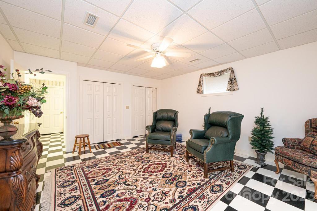 3808 Grace Chapel Road Granite Falls, NC 28630 - Photo 33 of 48 a living room with furniture and a potted plant