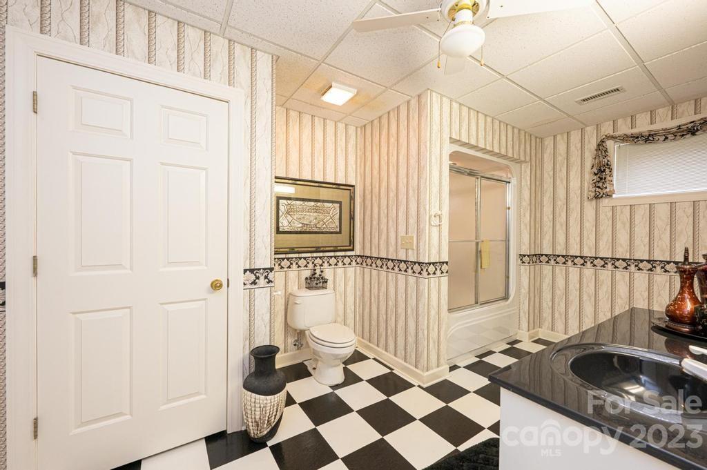 3808 Grace Chapel Road Granite Falls, NC 28630 - Photo 34 of 48 a bathroom with a sink and a mirror