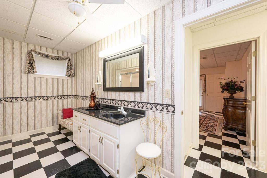 3808 Grace Chapel Road Granite Falls, NC 28630 - Photo 35 of 48 a kitchen with a sink a refrigerator and cabinets