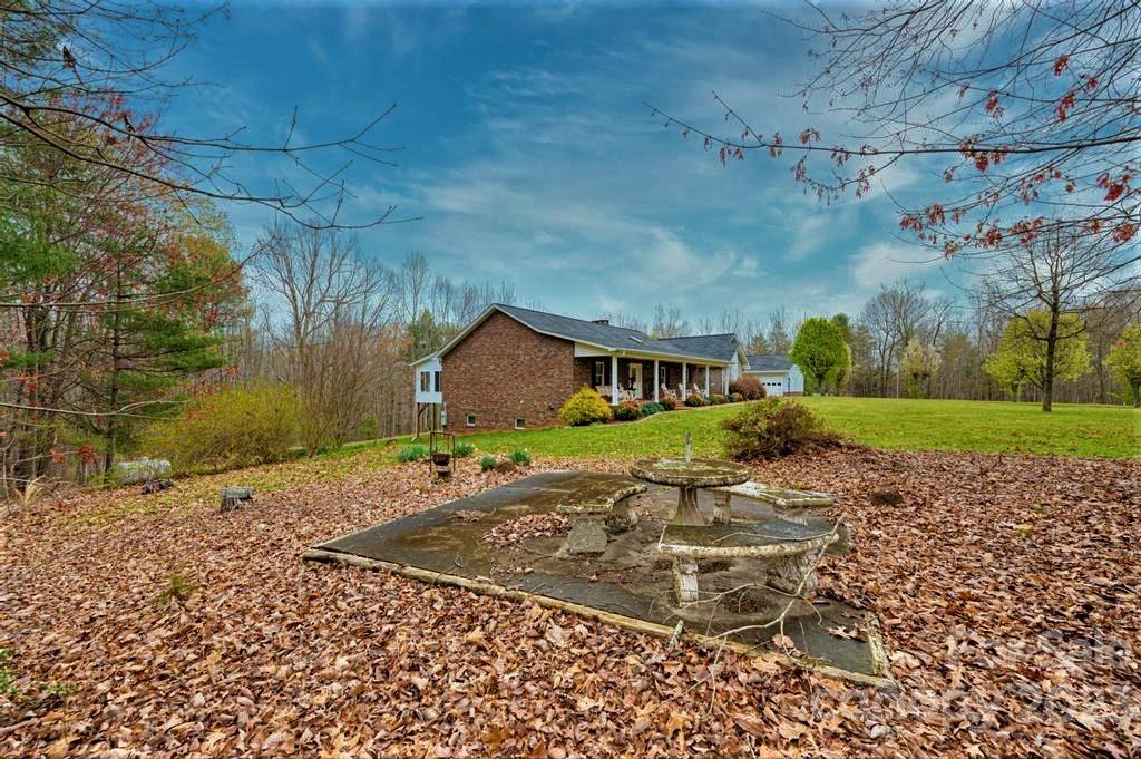 3808 Grace Chapel Road Granite Falls, NC 28630 - Photo 37 of 48 a front view of a house with a yard