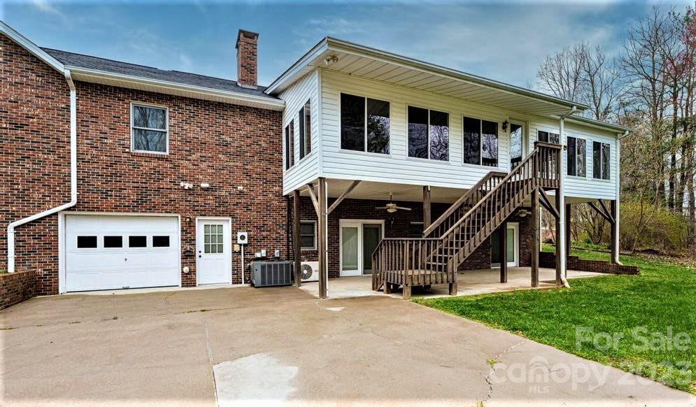 3808 Grace Chapel Road Granite Falls, NC 28630 - Photo 39 of 48 a view of a house with a barbeque and large trees